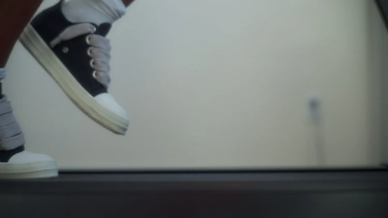 Close up of man's sneakers running on a treadmill. Healthy lifestyle and sport.